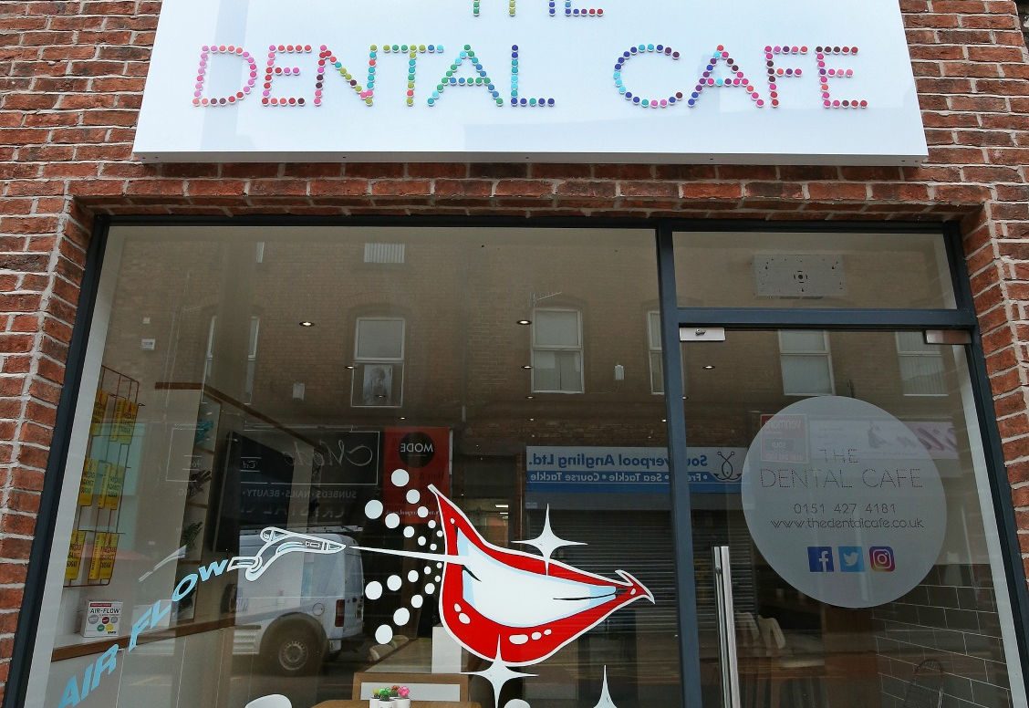 The Dental Cafe shopfront, with the practice name picked out in coloured dots on the fascia.